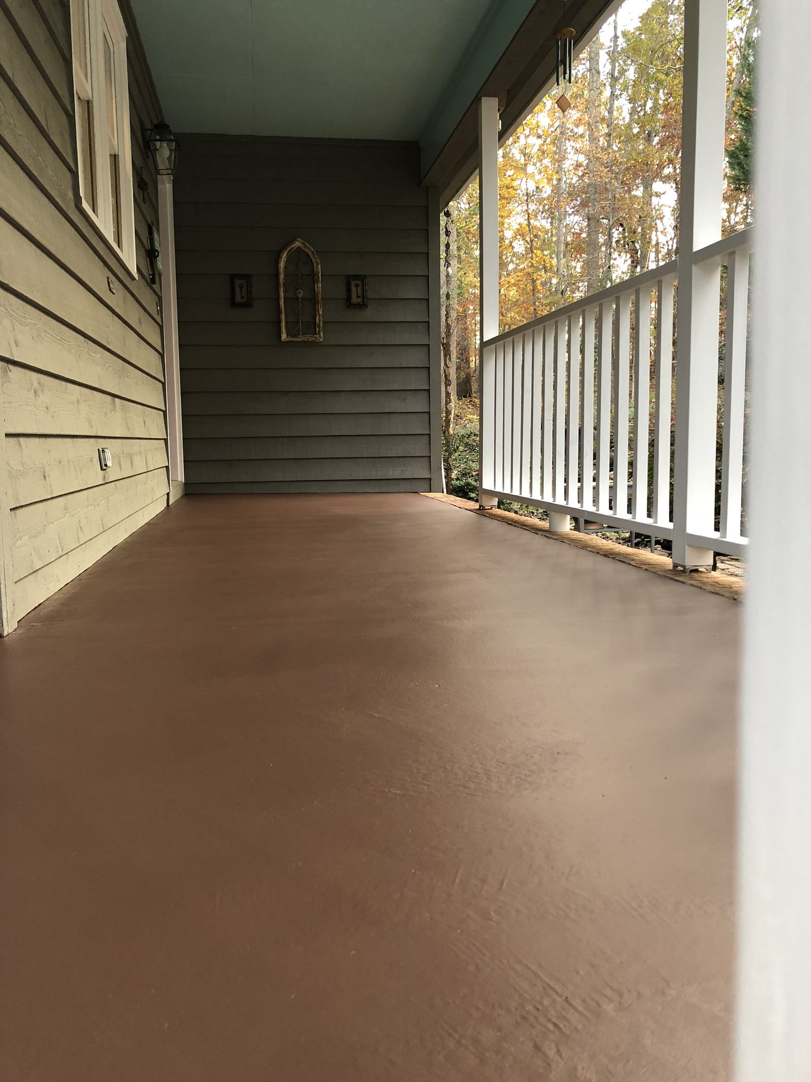 Front porch floor painted with a durable porch and floor coating — exterior painting by Roca’s Painters of Mebane, NC